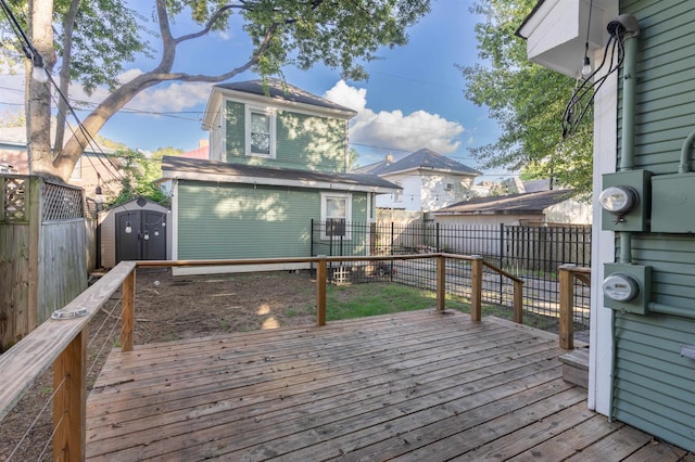 wooden deck with a storage shed