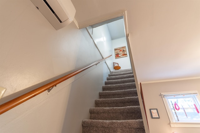 staircase with a wall mounted air conditioner