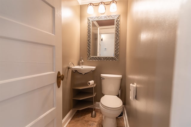 bathroom with vanity, crown molding, toilet, and tile patterned floors