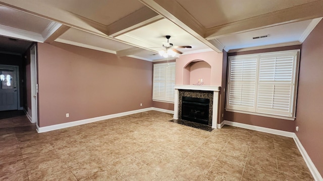 unfurnished living room with beamed ceiling, a fireplace, crown molding, and ceiling fan