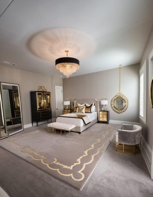 carpeted bedroom featuring an inviting chandelier