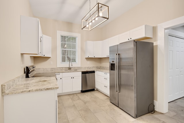 kitchen featuring light stone counters, sink, white cabinetry, hanging light fixtures, and stainless steel appliances