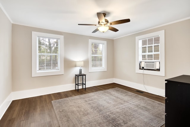 unfurnished room with ceiling fan, plenty of natural light, and dark wood-type flooring