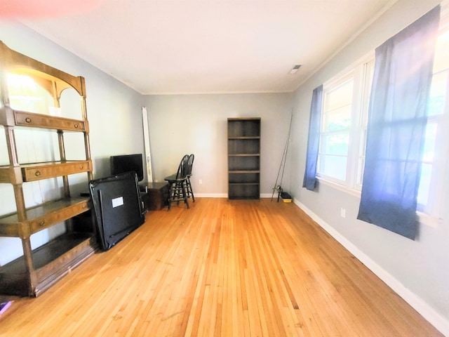 office featuring ornamental molding and hardwood / wood-style floors