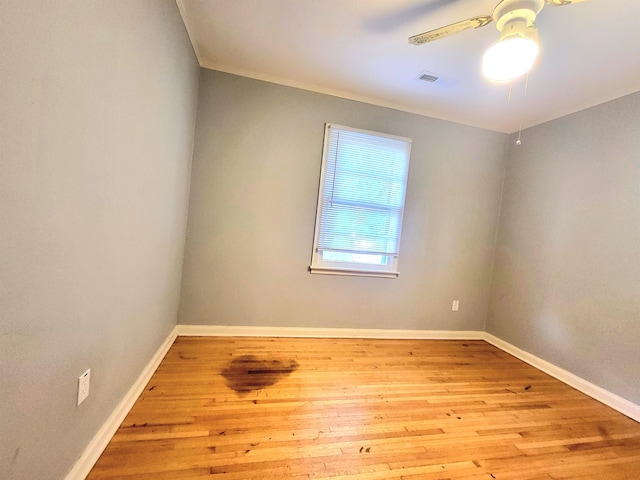 empty room featuring crown molding, ceiling fan, and light hardwood / wood-style flooring