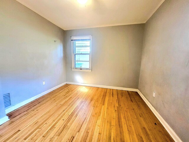 empty room with light wood-type flooring