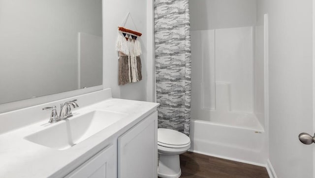 bathroom with toilet, shower / bath combination with curtain, wood finished floors, and vanity