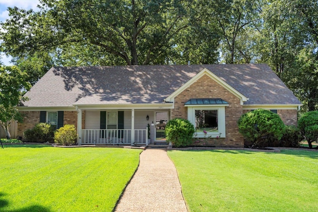 view of front facade with a porch and a front yard