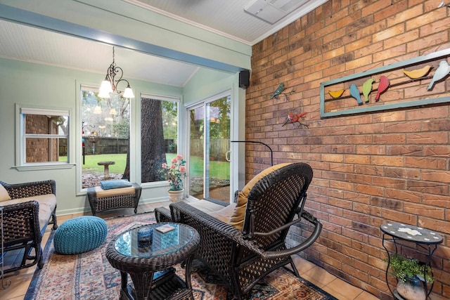 sunroom / solarium with a notable chandelier