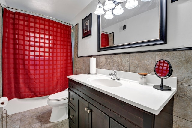 full bathroom featuring tile walls, shower / tub combo, vanity, toilet, and tile patterned floors