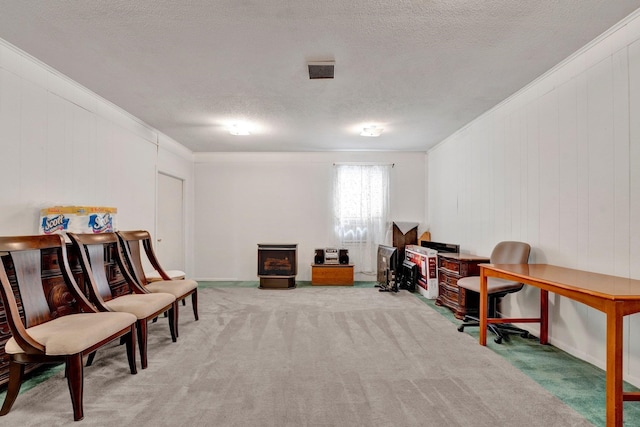 interior space with light carpet, a textured ceiling, and crown molding