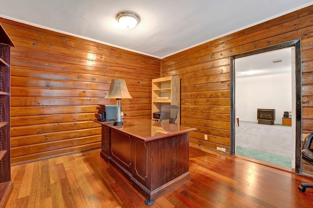 office area with wood walls and hardwood / wood-style floors