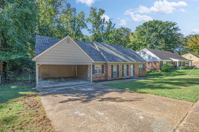 ranch-style house with a carport and a front lawn