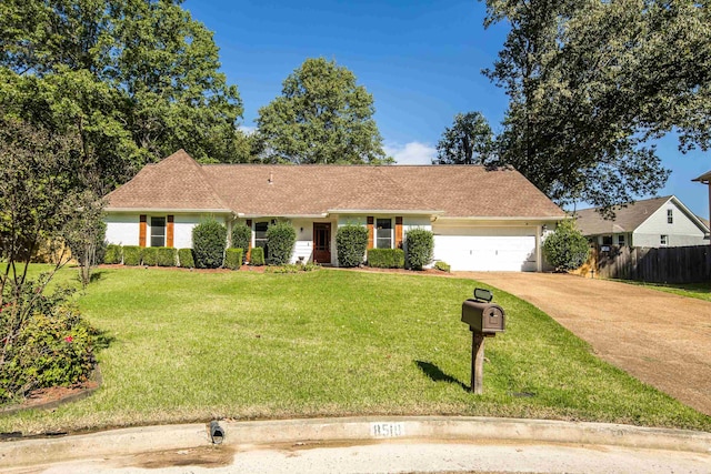 view of front of home featuring a front yard and a garage