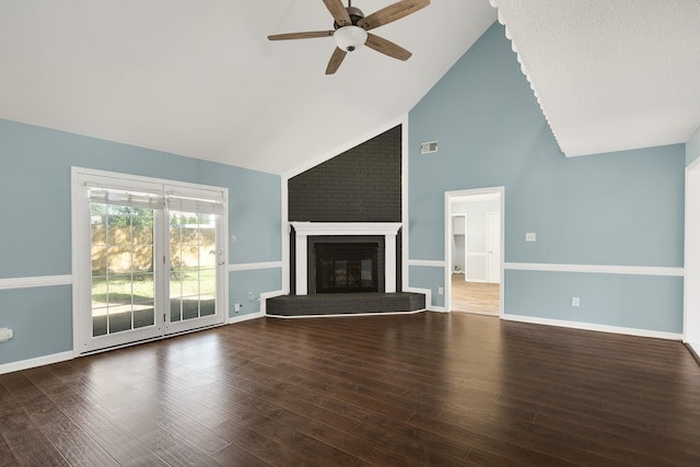 unfurnished living room with high vaulted ceiling, ceiling fan, a fireplace, and dark wood-type flooring