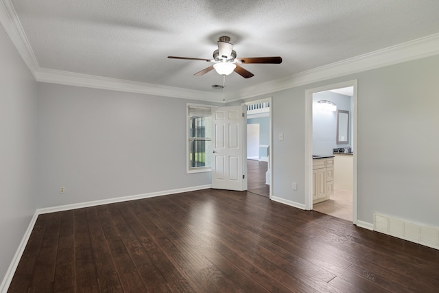 unfurnished bedroom with dark wood-type flooring, a textured ceiling, ceiling fan, ensuite bathroom, and ornamental molding