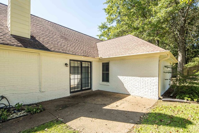 property entrance with a patio area