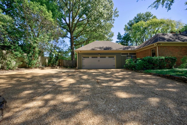 view of property exterior with a garage