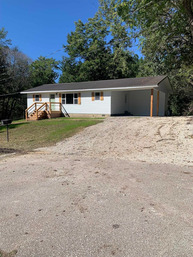 view of front of home with a carport