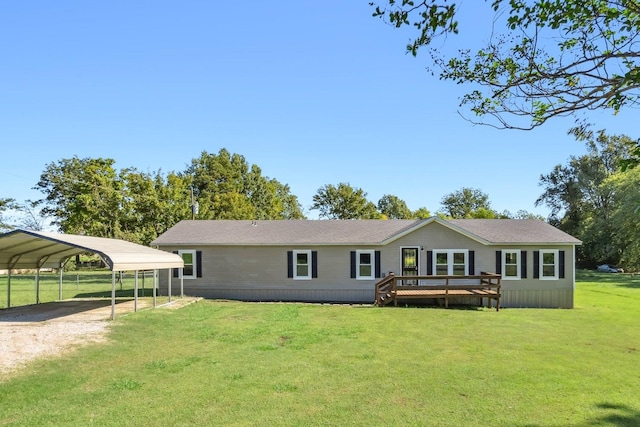 view of front facade featuring a front yard, a deck, and a carport