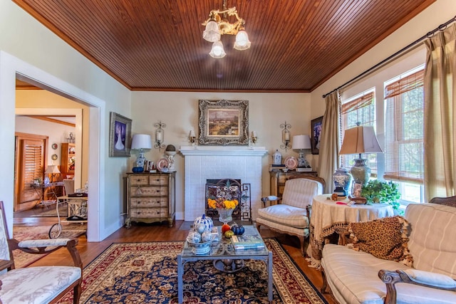 living room featuring a tile fireplace, wood-type flooring, wood ceiling, and crown molding