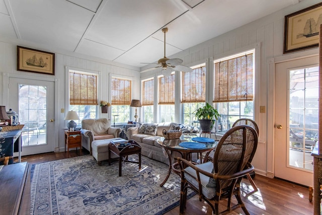 sunroom / solarium featuring ceiling fan