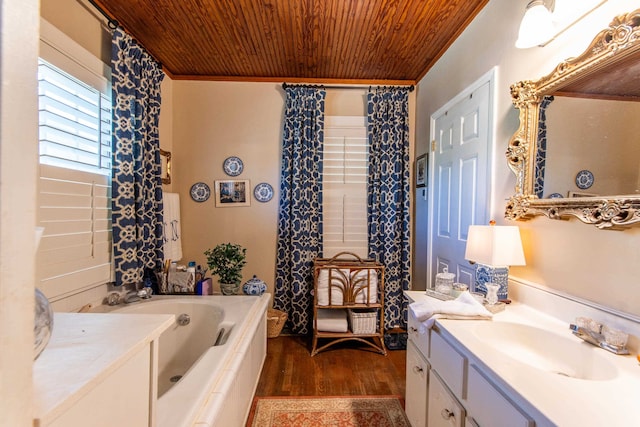 bathroom featuring vanity, a tub to relax in, hardwood / wood-style floors, and wooden ceiling