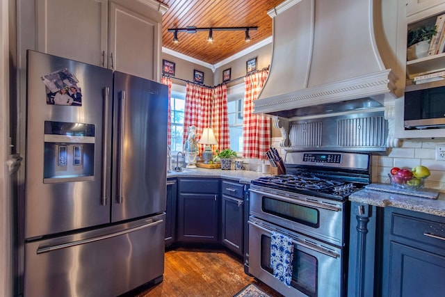 kitchen featuring appliances with stainless steel finishes, light wood-type flooring, crown molding, wooden ceiling, and custom exhaust hood