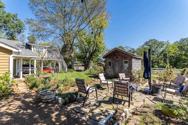 view of patio featuring an outdoor hangout area and an outbuilding