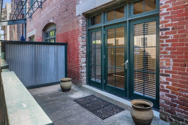 property entrance featuring french doors