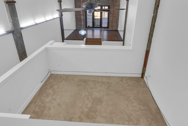 empty room with light colored carpet