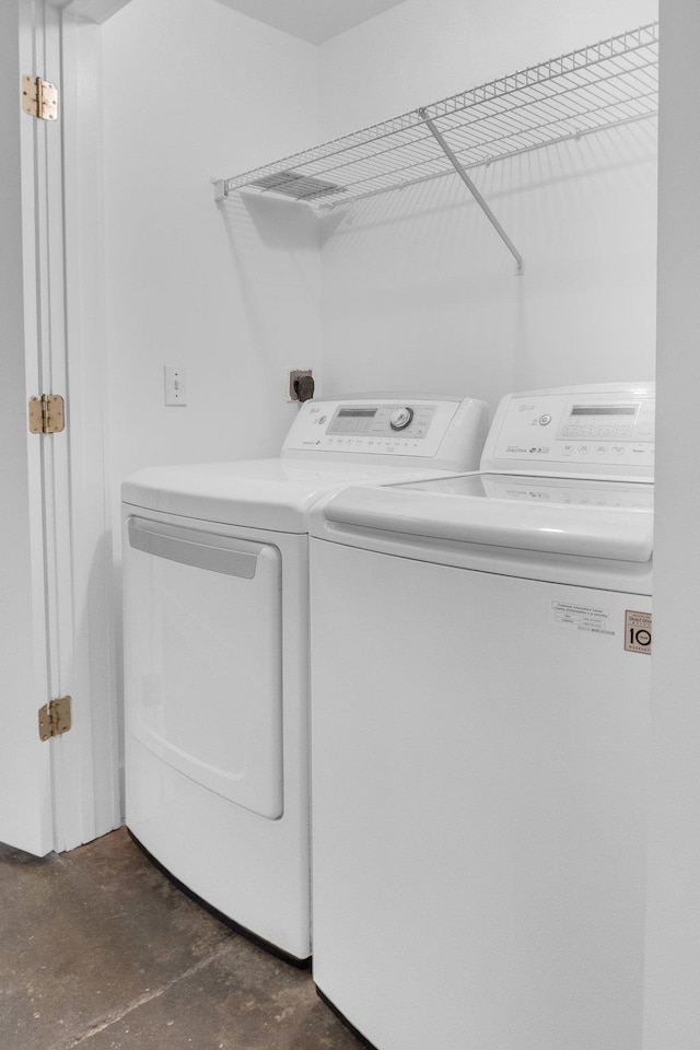 laundry room with washer and clothes dryer