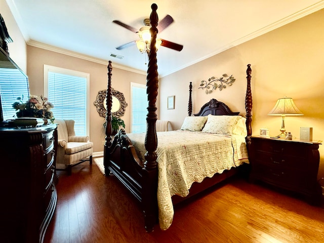 bedroom featuring ornamental molding, ceiling fan, and hardwood / wood-style floors