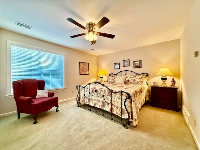 bedroom with ceiling fan and light colored carpet