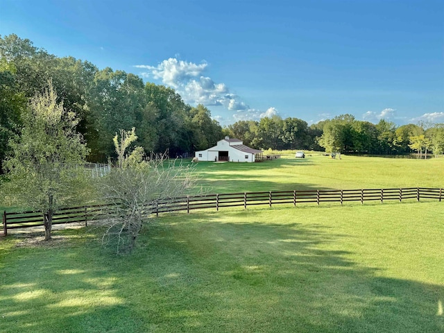 view of yard with a rural view