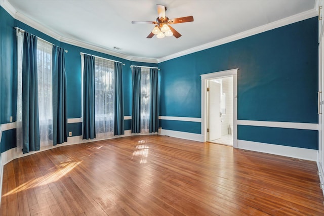 empty room featuring crown molding, hardwood / wood-style floors, and ceiling fan