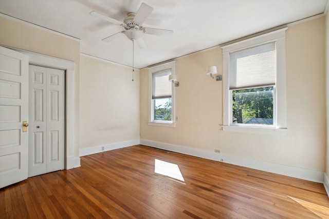 spare room featuring ceiling fan and hardwood / wood-style flooring