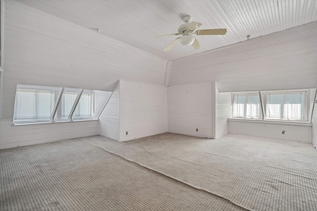 bonus room featuring vaulted ceiling, ceiling fan, and light colored carpet