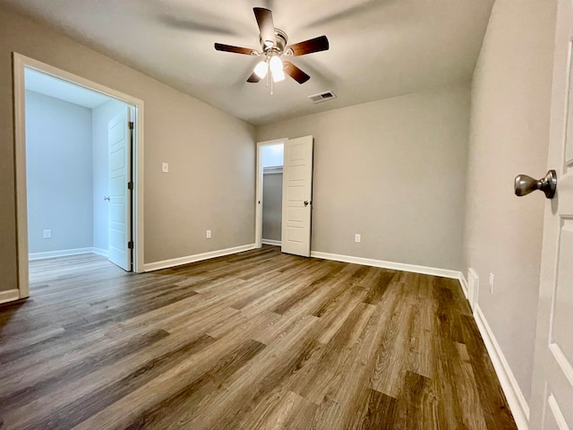 unfurnished bedroom featuring ceiling fan and hardwood / wood-style flooring