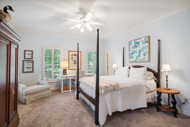 bedroom with ceiling fan, crown molding, and light carpet