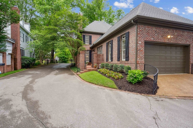 view of side of property with a garage