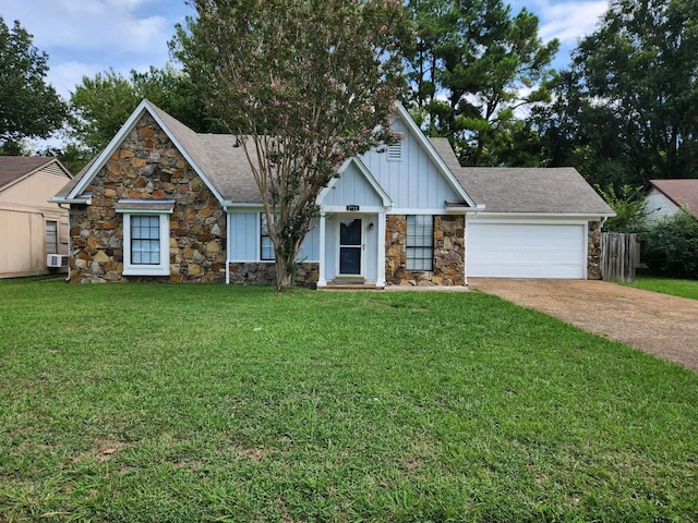 view of front facade with a front yard and a garage