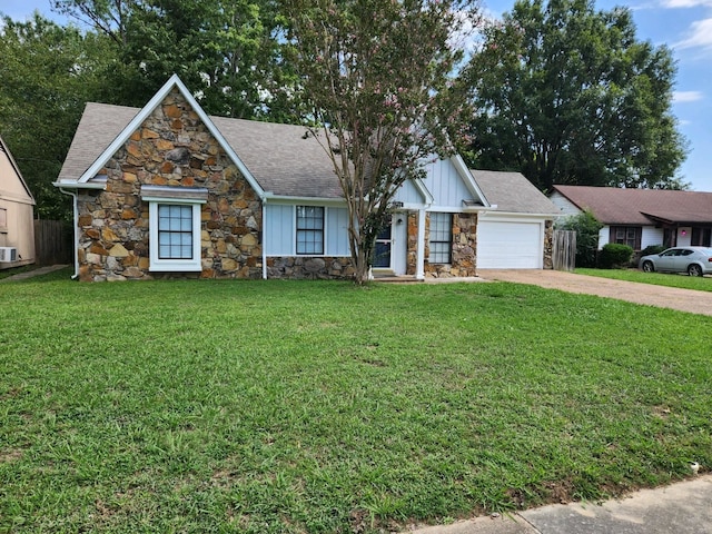 view of front of home with a garage and a front lawn