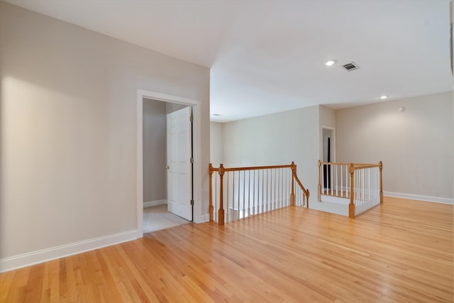 unfurnished room with light hardwood / wood-style flooring