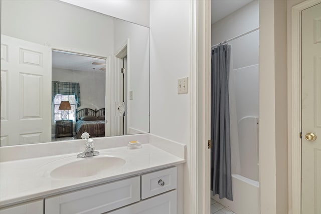 bathroom with shower / tub combo, vanity, and tile patterned floors