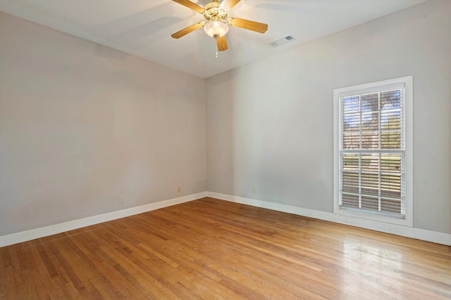 spare room featuring light hardwood / wood-style floors and ceiling fan