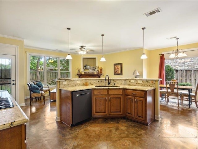 kitchen featuring pendant lighting, dishwasher, sink, and an island with sink