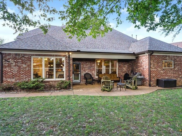 rear view of property featuring a patio and a yard