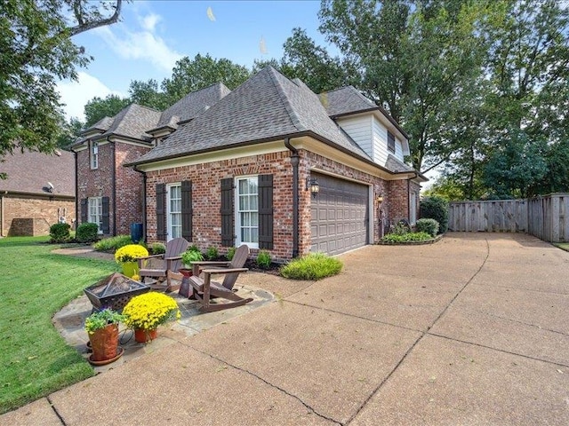 exterior space featuring a front lawn and a garage