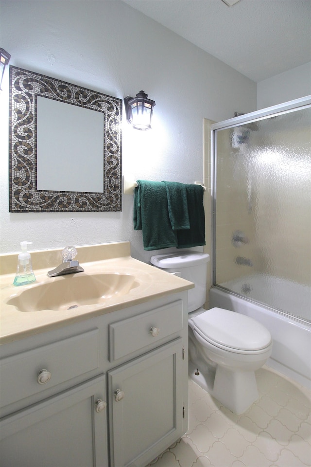 full bathroom featuring shower / bath combination with glass door, vanity, and toilet